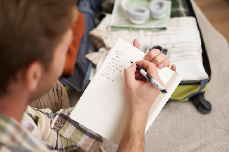 close-up-portrait-man-going-through-checklist-packing-holiday-looking-items-he-wants_1258-270242