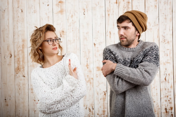 couple-looking-each-other-wooden-wall-girl-refuse_176420-11346
