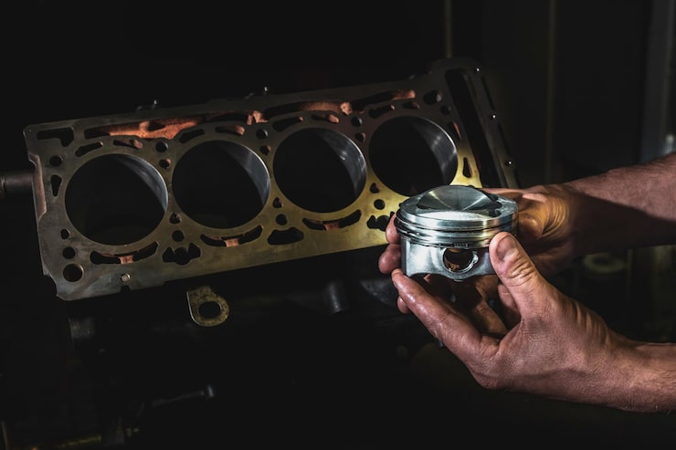 engine-cylinder-hands-mechanic-auto-engine-repair-services_752567-4264