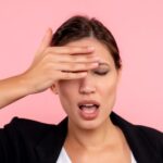 front-view-young-pretty-female-pink-background_179666-26609