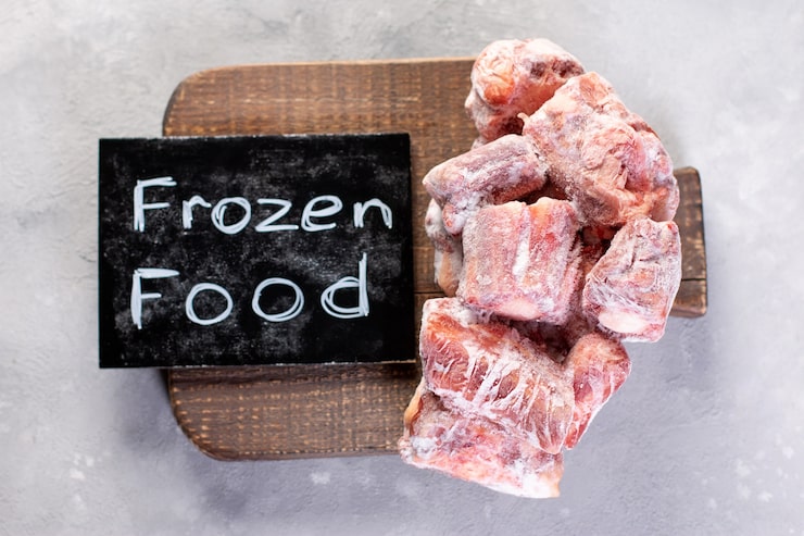 frozen-raw-beef-bones-cutting-board_286393-1182