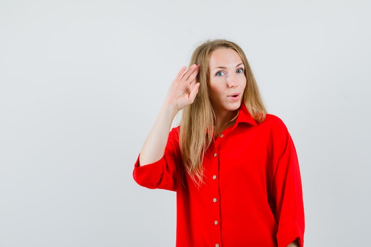 lady-red-shirt-showing-salute-gesture-looking-confident_176474-39784
