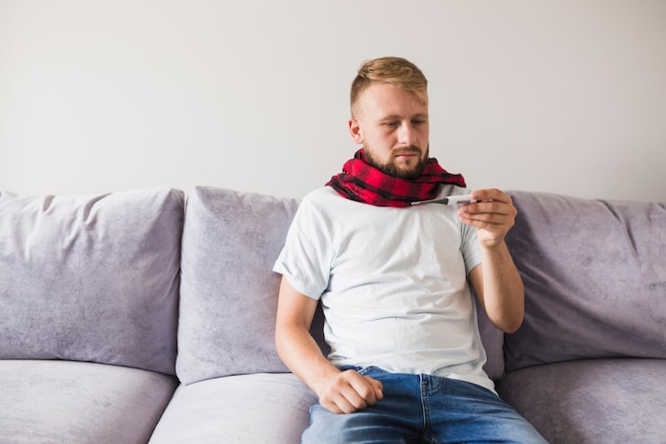 man-scarf-looking-thermometer_23-2147934441