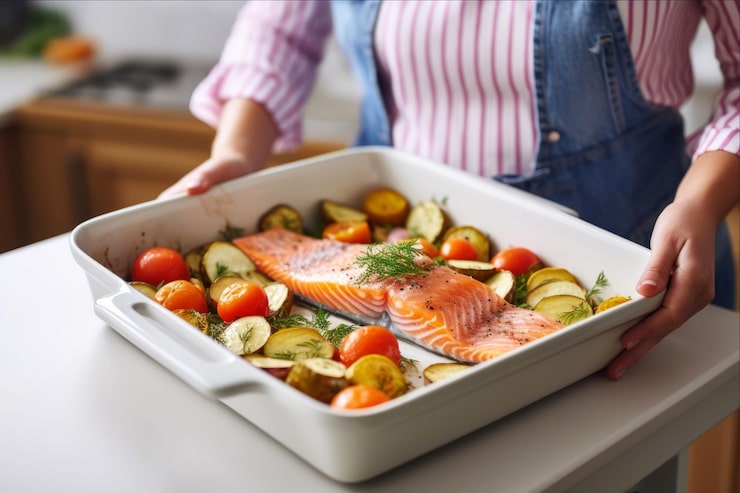 person-is-holding-tray-fish-vegetables_1000124-287317
