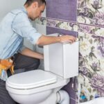 plumber-fixing-toilet-seat-lid_493343-31037