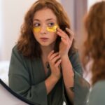 woman-enjoying-her-beauty-routine-with-golden-eye-patches_23-2150166453