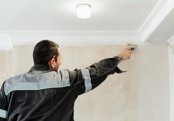 worker-applies-glue-walls-before-wallpapering-primer-walls-idea-renovation-restoration-apartments-selective-focus-brush_166373-2216