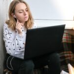 young-woman-sitting-balcony-laptop-online-education-stay-home-concept-work-from-home_1033085-574
