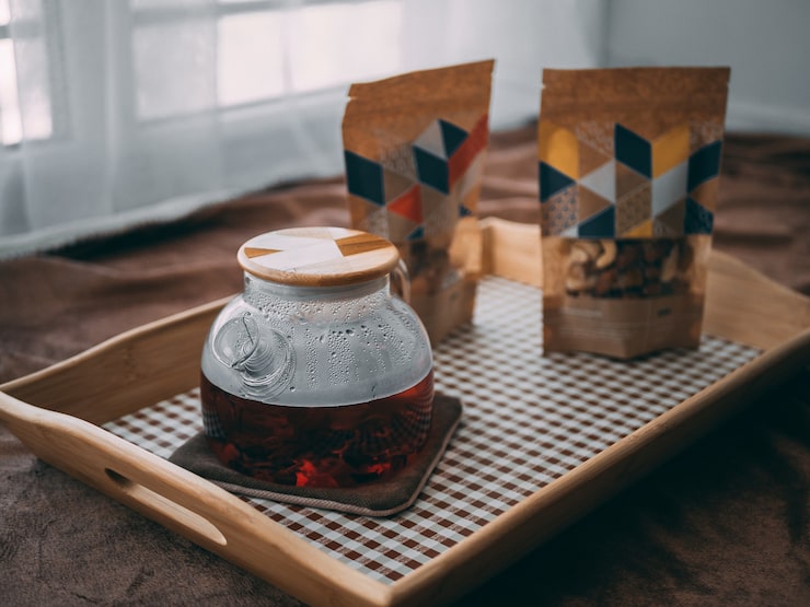 closeup-glass-jar-with-wooden-cap-wooden-tray_181624-45964