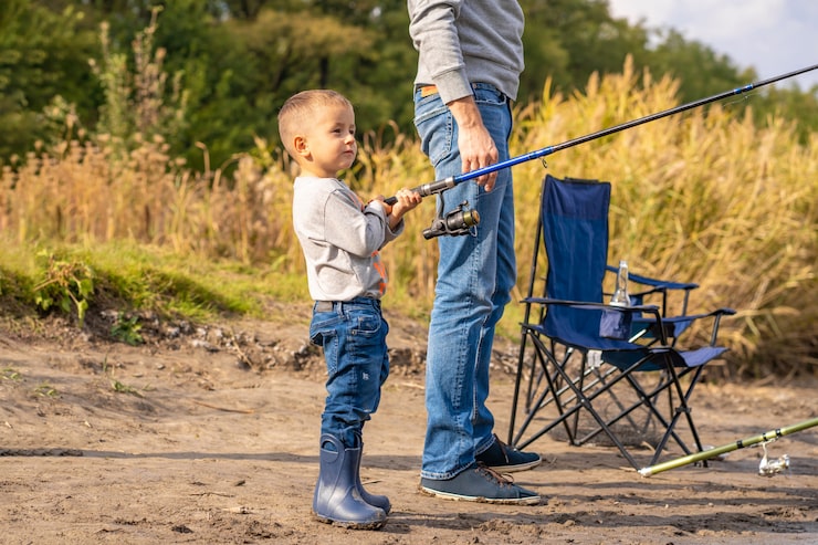 happy-family-spends-time-together-they-teach-their-son-fish_105751-5234