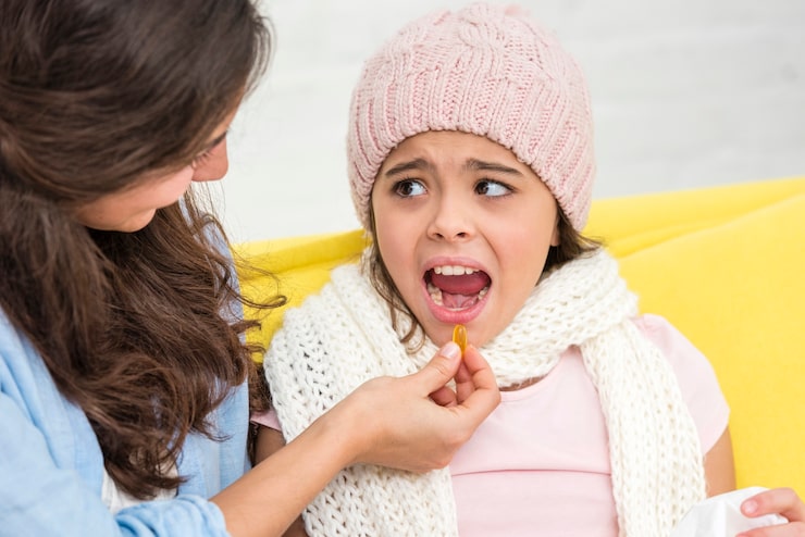 mother-giving-her-daughter-pill_23-2148396079