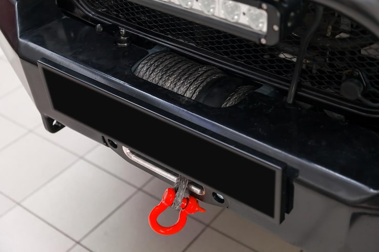 towing-winch-with-carabiner-loop-metal-cable-mounted-car-pulling-out-evacuating-vehicles-overcoming-offroad-extreme-racing_136863-3313