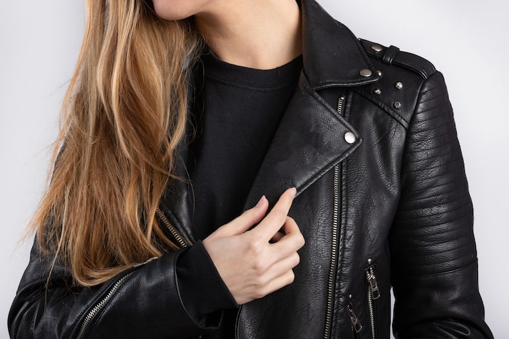 young-female-wearing-jacket-standing-against-white-wall_181624-40808